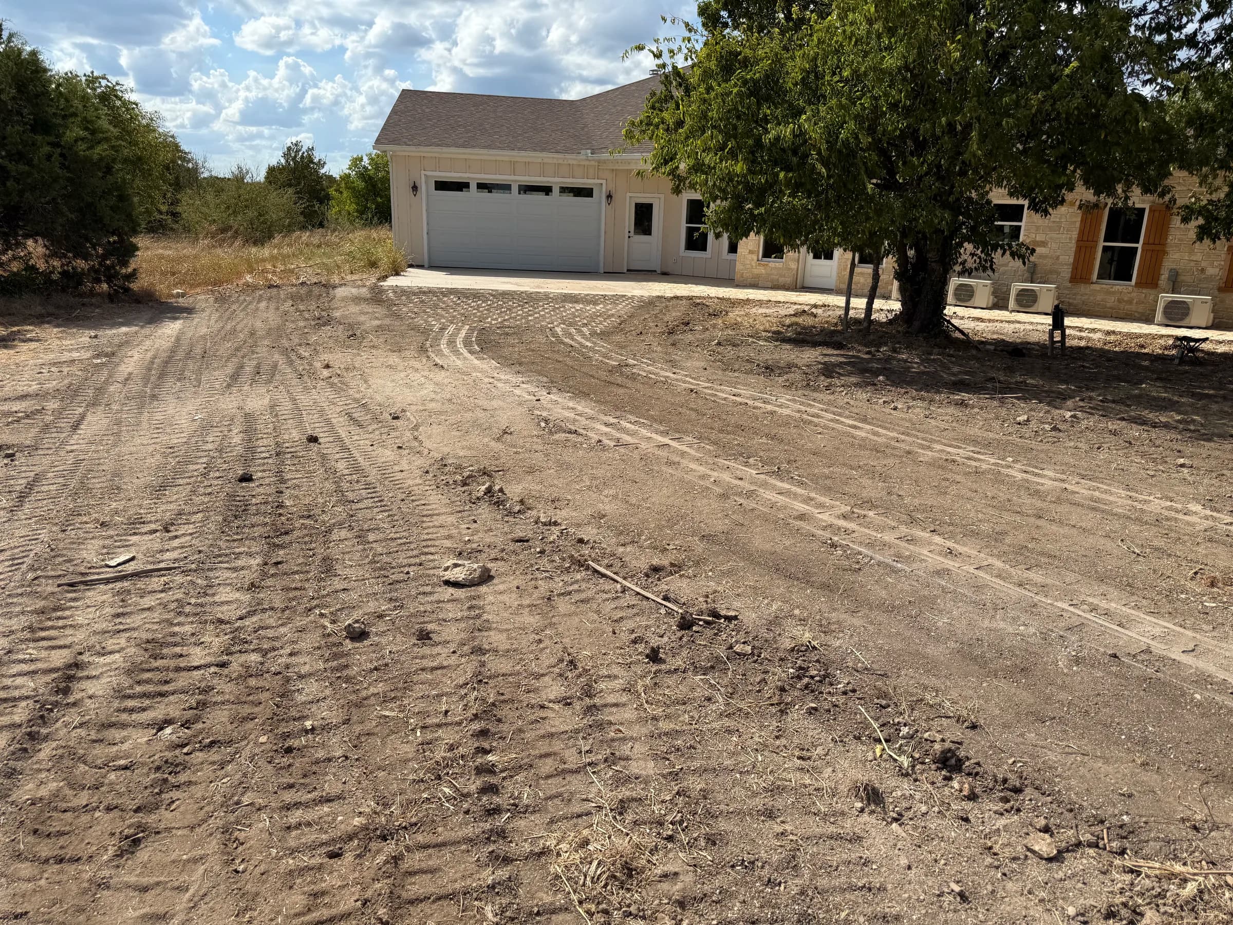 Concrete driveway strips installed at the White Hall property