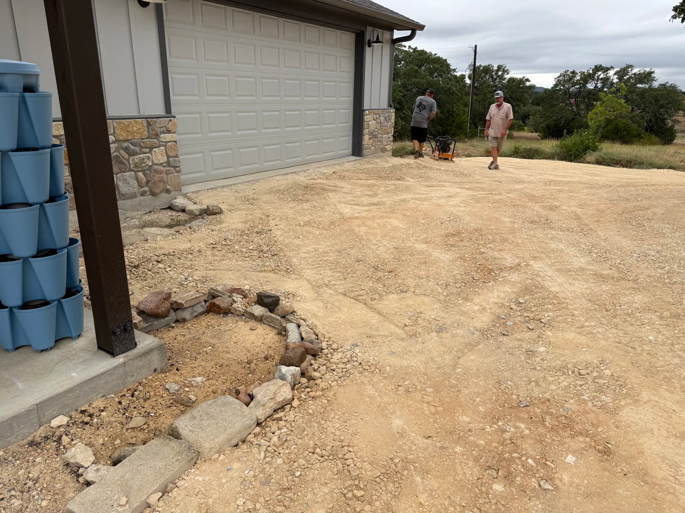 Branded B crew working on the aggregate approach beside a garage in Ding Dong