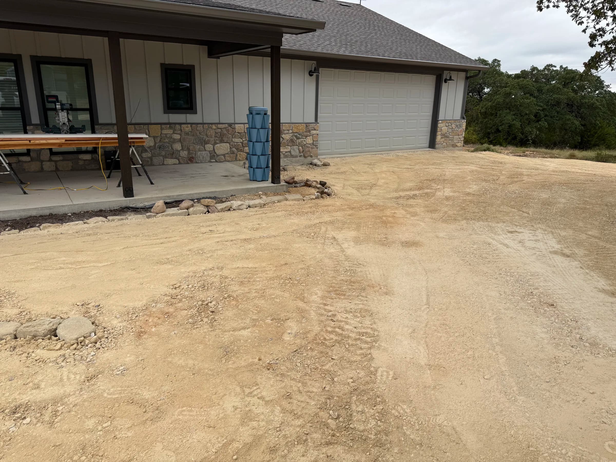 Compacted aggregate driveway approaching the garage at the Ding Dong home
