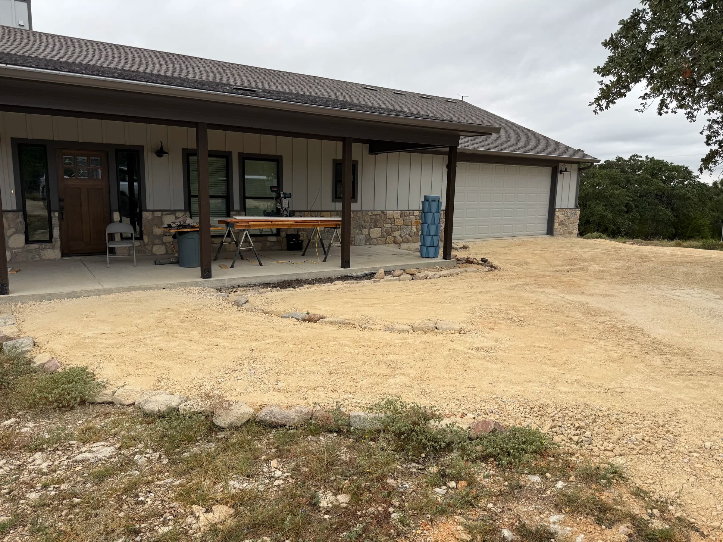 Graded aggregate driveway and approach beside the home in Ding Dong